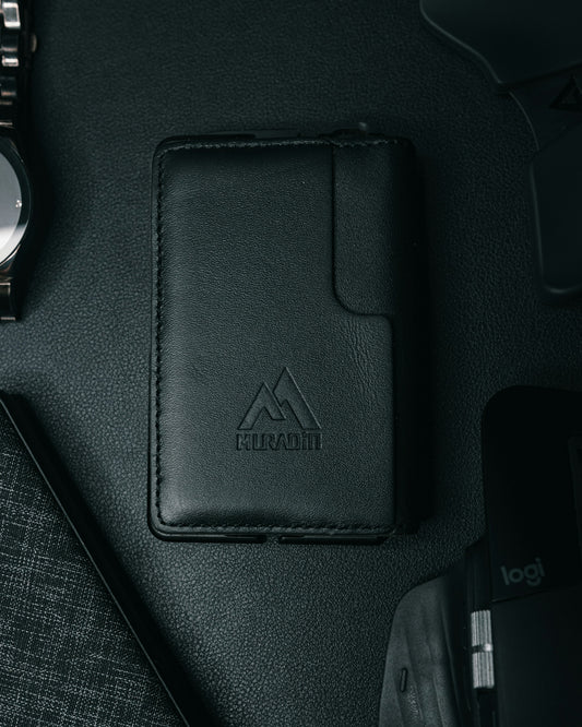 a wallet, watch, and other items on a table