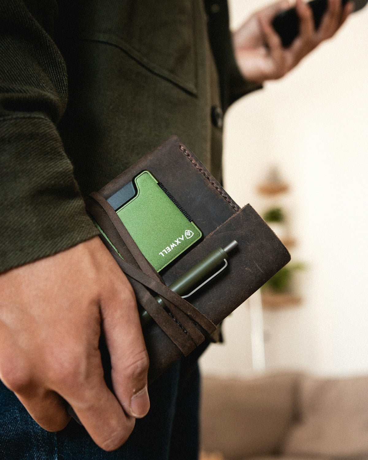 a person holding a black device