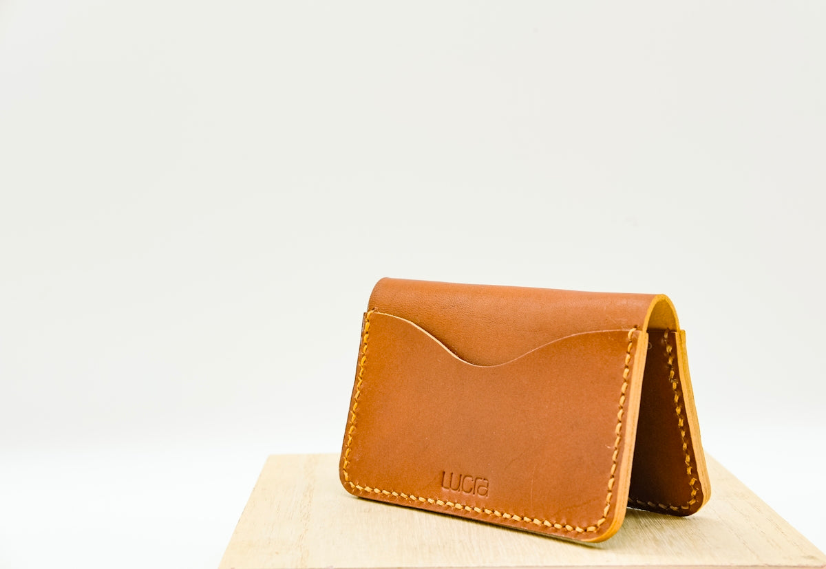 A brown leather wallet sits open.
